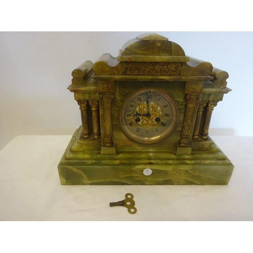 57 - Antique green marble mantel clock with brass columns and pillars.