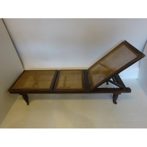 59 - Antique mahogany folding campain style bed raised on turned legs.