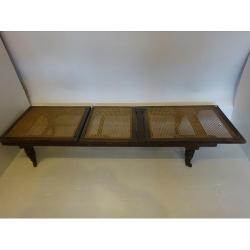 59 - Antique mahogany folding campain style bed raised on turned legs.