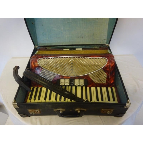 74 - Two musical instruments, one cased. As found.