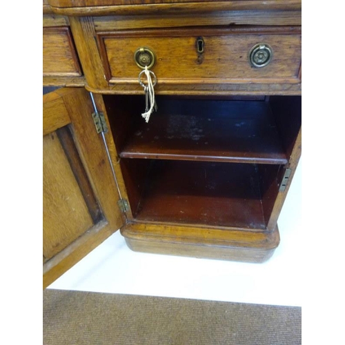 75 - Victorian oak partners desk fitted with drawers and cupboards and raised on plinth base. 152cm x 92c... 