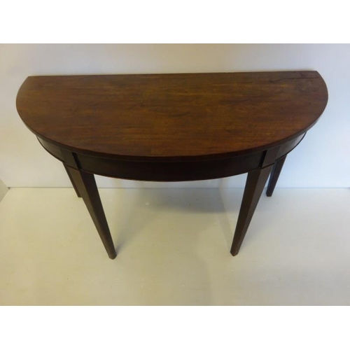 78 - Georgian mahogany demi lune side table or small dining table raised on tapered legs, nice colour. W.... 