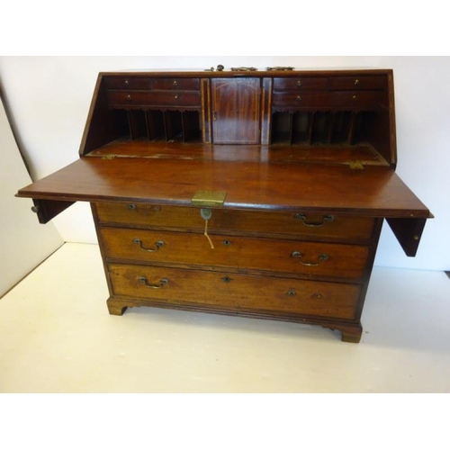 80 - Georgian mahogany sloped front bureau with nicely fitted interior over four drawers and raised on br... 