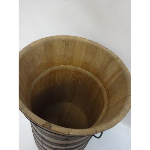 9 - Tall oak and metal banded barrel. H. 90cm, W. 55cm approx.