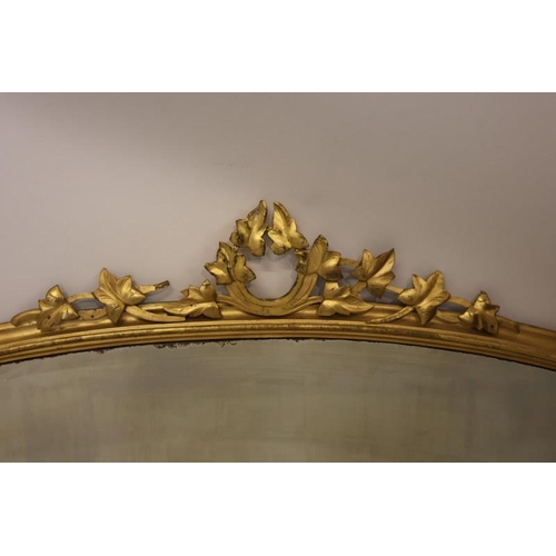 94 - Victorian giltwood overmantle mirror having bevelled glass plate and candle sconces. H. 119cm x 140c... 