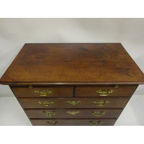 100 - An Irish Georgian mahogany chest of 2 short & 3 long drawers with pull out slide & raised on bracket... 