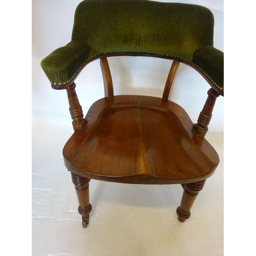 107 - A good antique mahogany desk or library chair having upholstered arms and back and raised on turned ... 