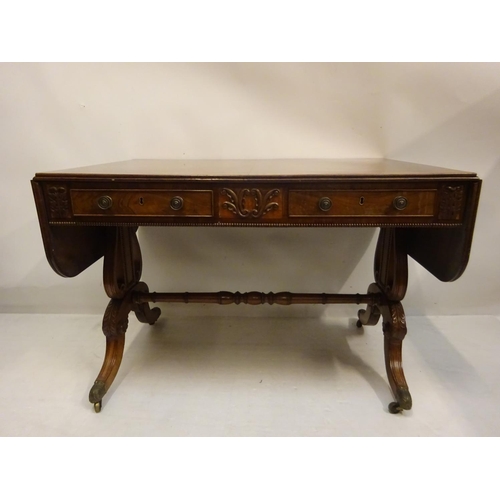 112 - A Cork Regency mahogany and satinwood banded sofa table fitted with real and dummy drawers and raise... 