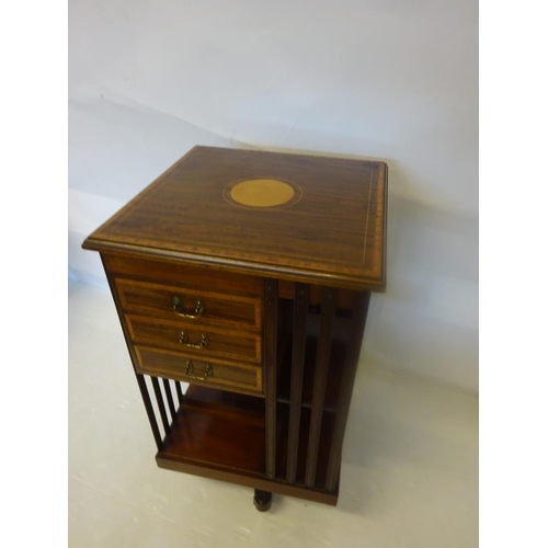 117 - Mahogany and satinwood inlaid revolving book stand, one section fitted with drawers.