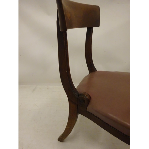 121 - A set of nine William IV mahogany dining chairs having curved bar back. (Some scroll timber pieces m... 