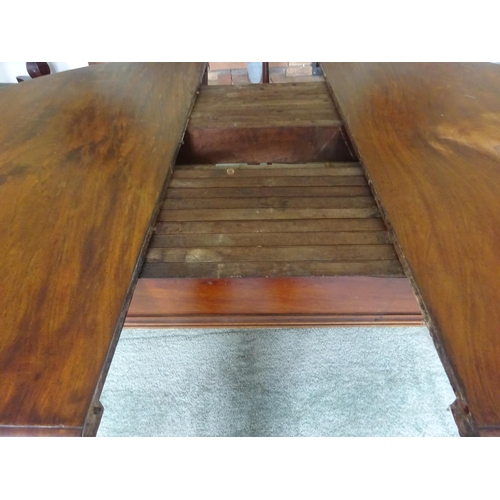 122 - Good Victorian mahogany dining table with two spare leaves.