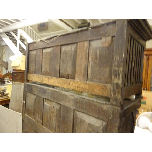 123 - A good 18th century oak court cupboard in three sections, the top section having plate rack with lat... 