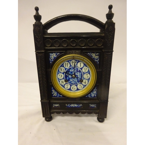 124 - Victorian ebonized cased mantle clock with blue porcelain dials and panels. Movement stamped.