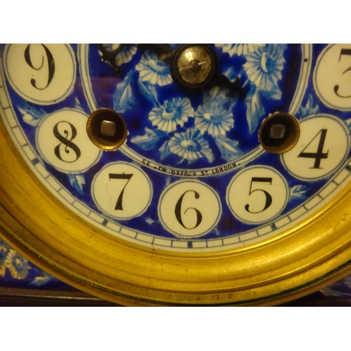 124 - Victorian ebonized cased mantle clock with blue porcelain dials and panels. Movement stamped.