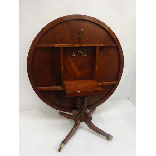 127 - A good Irish Georgian mahogany circular dining table having reeded edge, nicely turned centre column... 