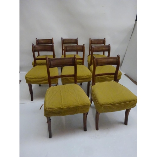 128 - A good set of 8 Georgian mahogany dining chairs raised on sabre legs.