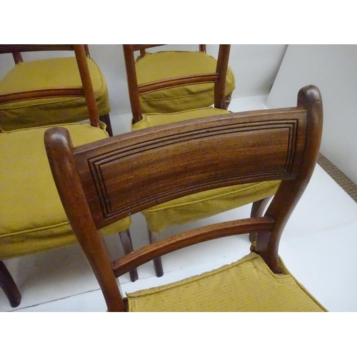 128 - A good set of 8 Georgian mahogany dining chairs raised on sabre legs.