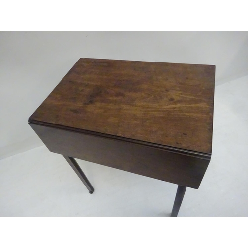 129 - A good Georgian mahogany neat size drop leaf table fitted with a long drawer and raised on square ch... 