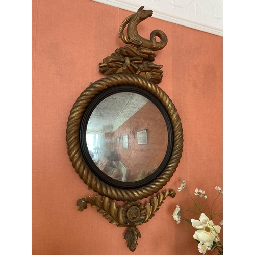 130 - A fine pair of antique Cork convex mirrors, each one with large rope twist circular frames and reede... 