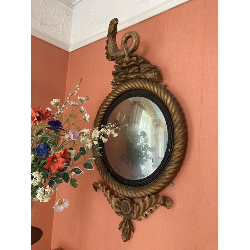 130 - A fine pair of antique Cork convex mirrors, each one with large rope twist circular frames and reede... 