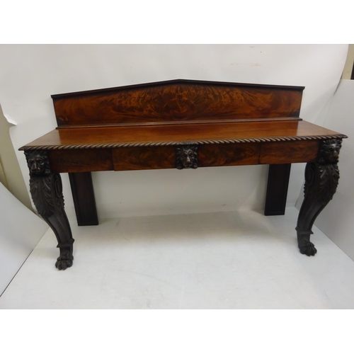 132 - A good Irish early 19th century mahogany server/side table, the top with shaped gallery and plate ra... 