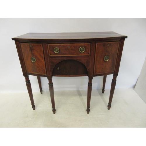 134 - A good Georgian mahogany and satinwood banded bow shaped sideboard fitted with drawers and tambour s... 