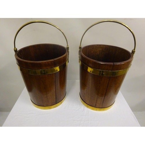 135 - A pair of Irish Georgian mahogany brass banded turf buckets with good carrying handles. H. 44cm, Dia... 