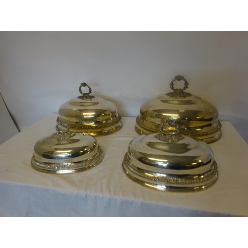 158 - A good set of 4 Sheffield plated graduated meat dish covers.