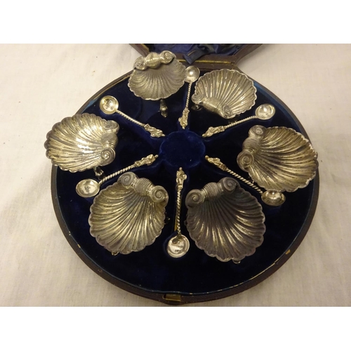 163 - A cased set of 6 shell shaped salts with 6 silver spoons, London 1861.