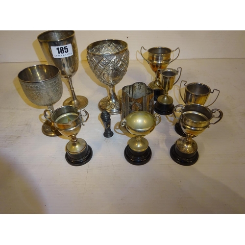 185 - A collection of one silver and several plated cups and a plated tankard and seal. The silver cup dat... 