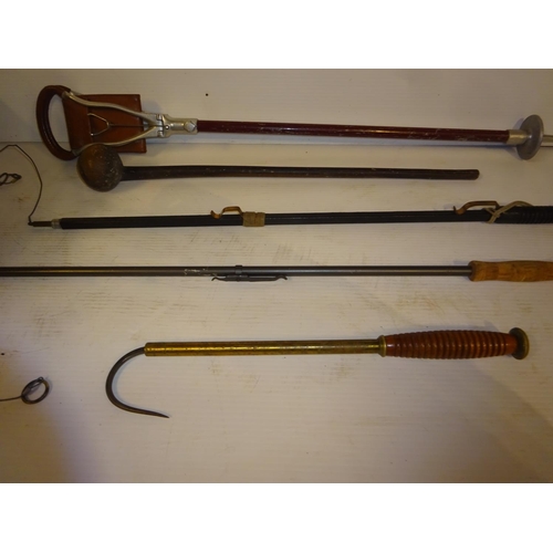 201 - A good old timber handled and brass fishing gaff together with a shouting stick, club and two snares... 