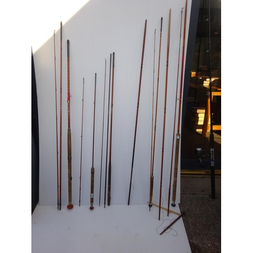 205 - Quantity of old cane fishing rods.