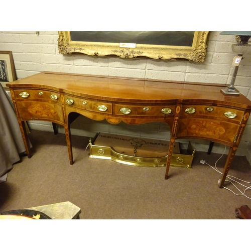 209 - A fine Georgian mahogany and satinwood inlaid sideboard, the serpentine shaped top over two centre d... 