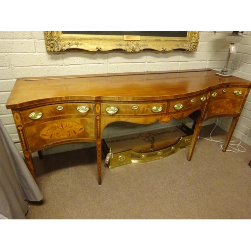 209 - A fine Georgian mahogany and satinwood inlaid sideboard, the serpentine shaped top over two centre d... 