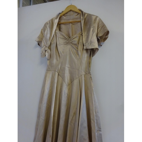 210 - A 1952 silk wedding dress. The material was sourced in London and the dress was made locally in Cobh... 