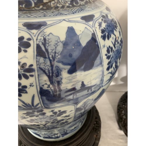 215 - A good pair of large antique Chinese blue and white baluster jars and covers, painted throughout wit... 