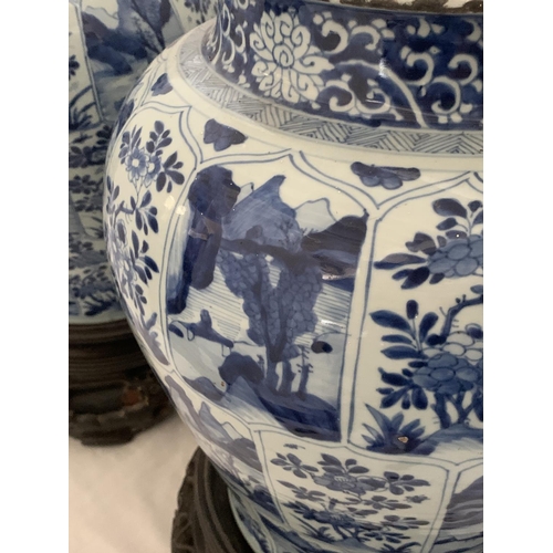 215 - A good pair of large antique Chinese blue and white baluster jars and covers, painted throughout wit... 