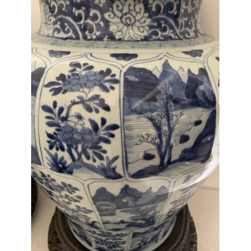 215 - A good pair of large antique Chinese blue and white baluster jars and covers, painted throughout wit... 