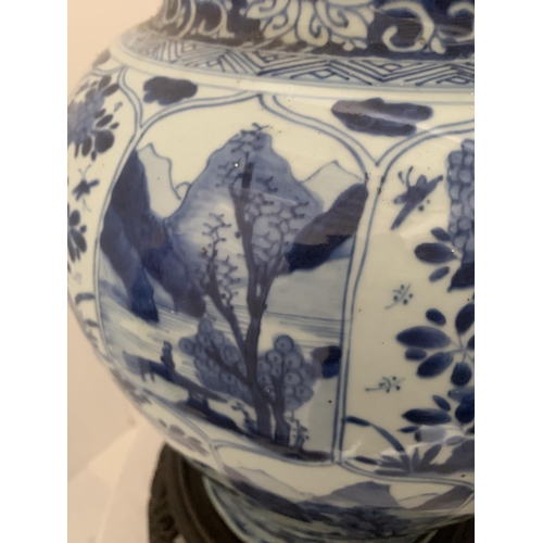 215 - A good pair of large antique Chinese blue and white baluster jars and covers, painted throughout wit... 