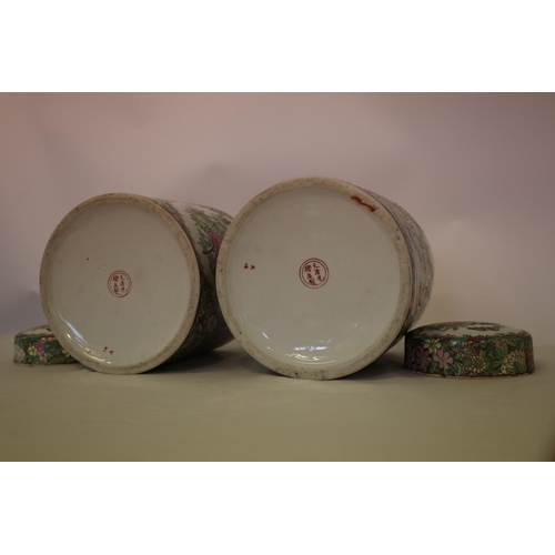 216 - A pair of Cantonese jars and lids.