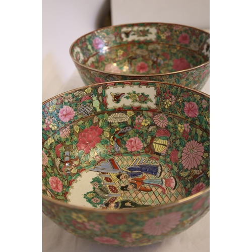 217 - A pair of Cantonese china bowls decorated throughout with figures and flowers. Diameter 30cm. Excell... 