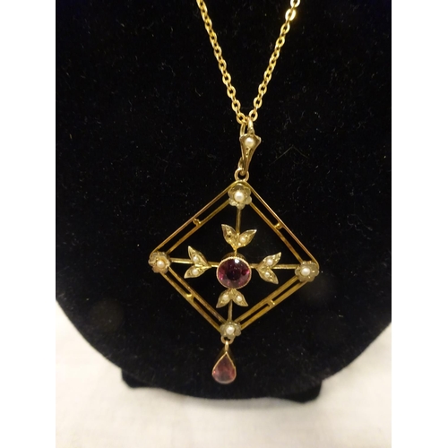 234 - Antique 9ct gold garnet and pearl set pendant drop with 9ct gold chain.