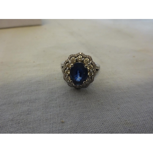 241 - 18k white gold blue sapphire and diamond ring. Size N/O.