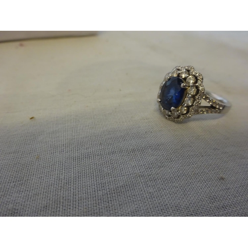 241 - 18k white gold blue sapphire and diamond ring. Size N/O.