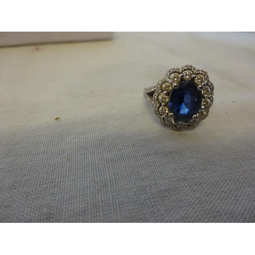 241 - 18k white gold blue sapphire and diamond ring. Size N/O.