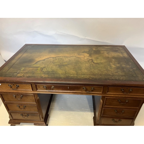 242 - Mahogany pedestal desk fitted with 9 drawers and raised on  bracket feet. 153cm x 90cm approx.