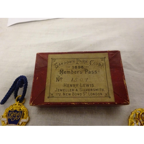 256 - A collection of 6 Victorian Members badges for Sandown Park Club with original box.