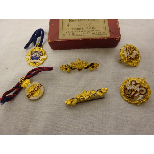 256 - A collection of 6 Victorian Members badges for Sandown Park Club with original box.