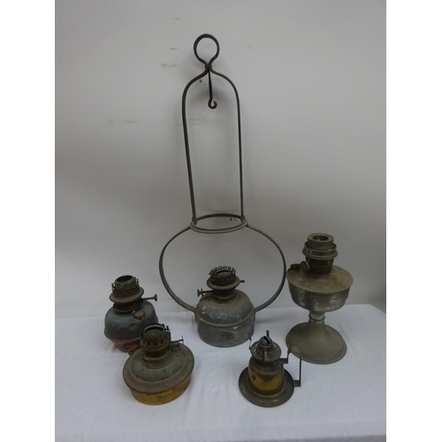 26 - Collection of oil lamps.