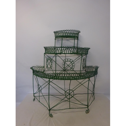 274 - An old wire work plant holder plus metal stand. W. 110cm, H. 120cm, D. 53cm approx.